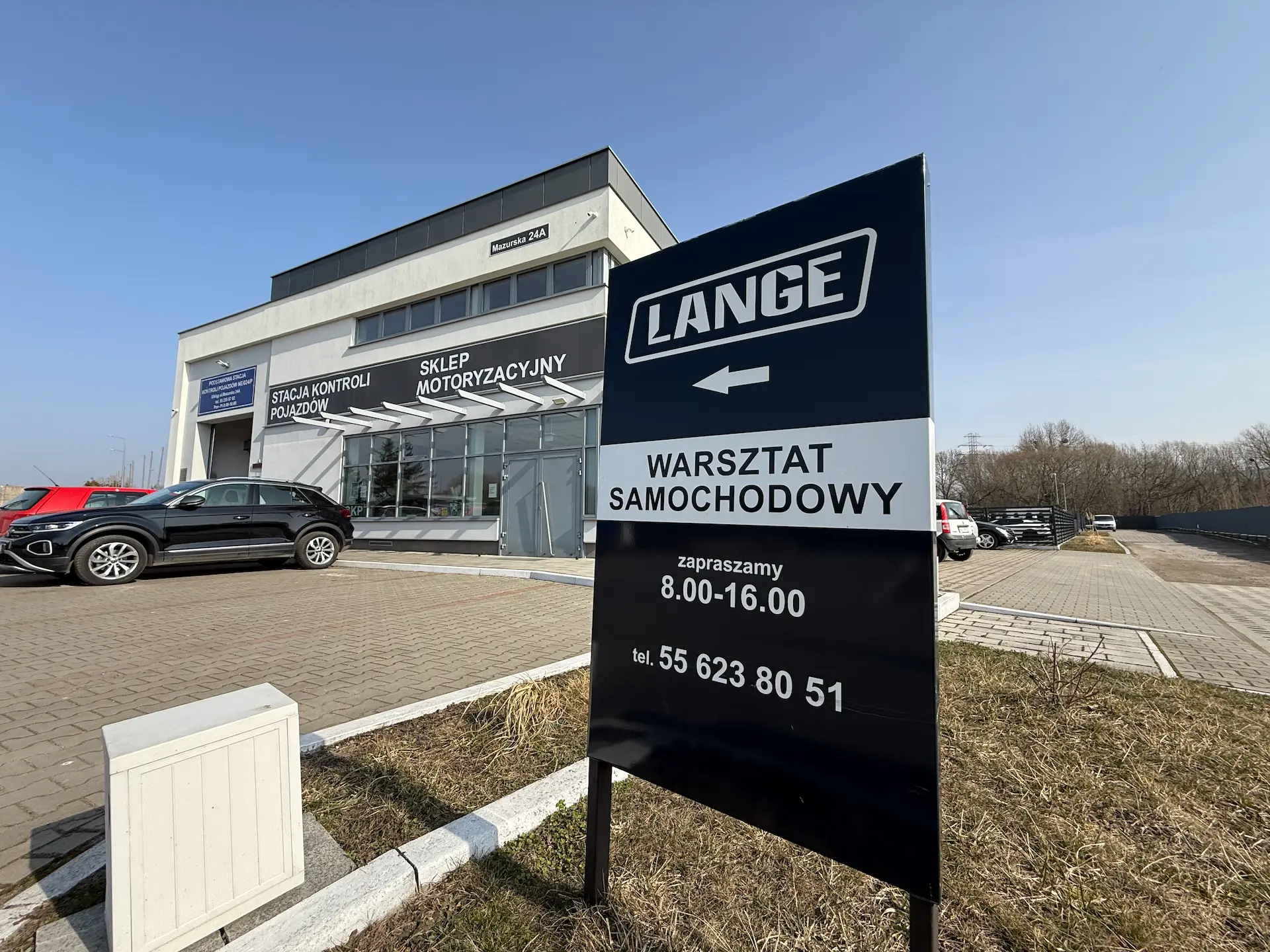 Tabliczka informacyjna PHU Lange — warsztat samochodowy Elbląg
